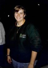 Picture of Robin Cooch Smiling with Dirty Blonde Hair Pulled Back in Ponytail