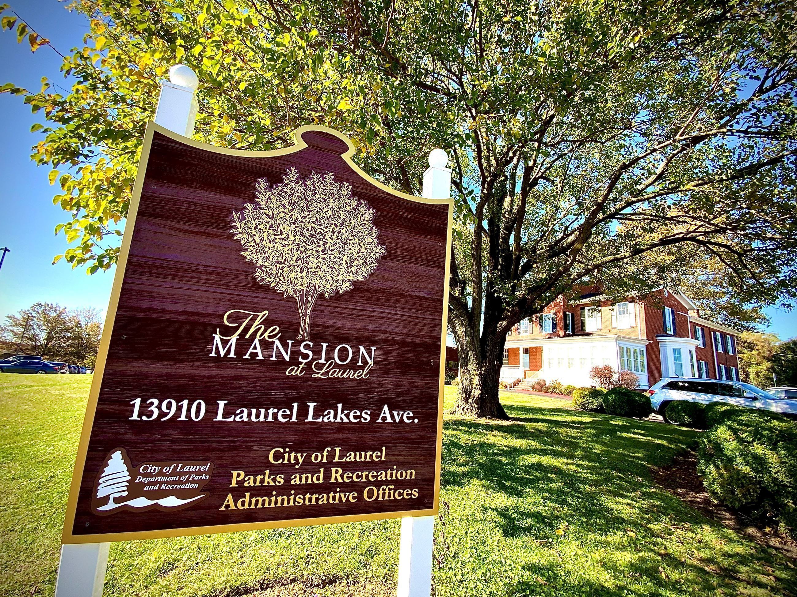 Picture of Facility Sign and Facility in the Background