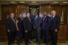 Six People Standing in a Row